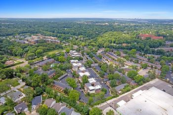 A bird's eye view of a residential area with houses and trees.
